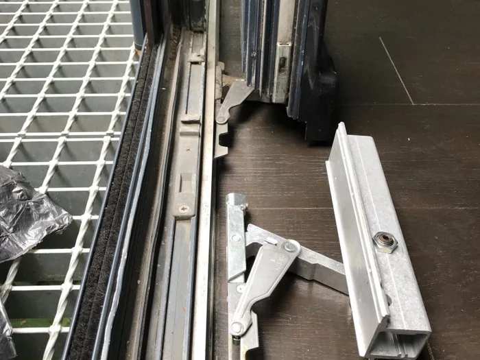 Specialist repairing a sliding patio door track